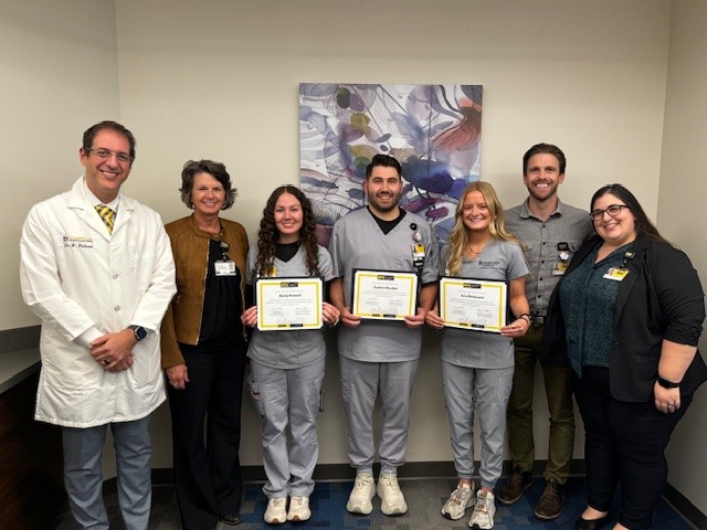 Group photo of 3 award recipients along with the chair of Radiology and the program directors for radiation sciences