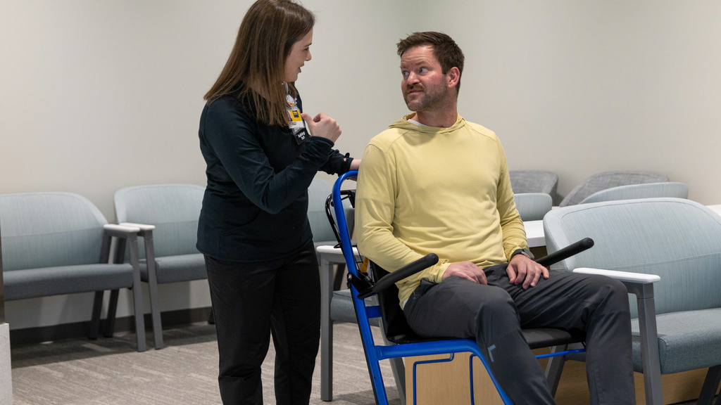 Rad tech with patient in wheelchair
